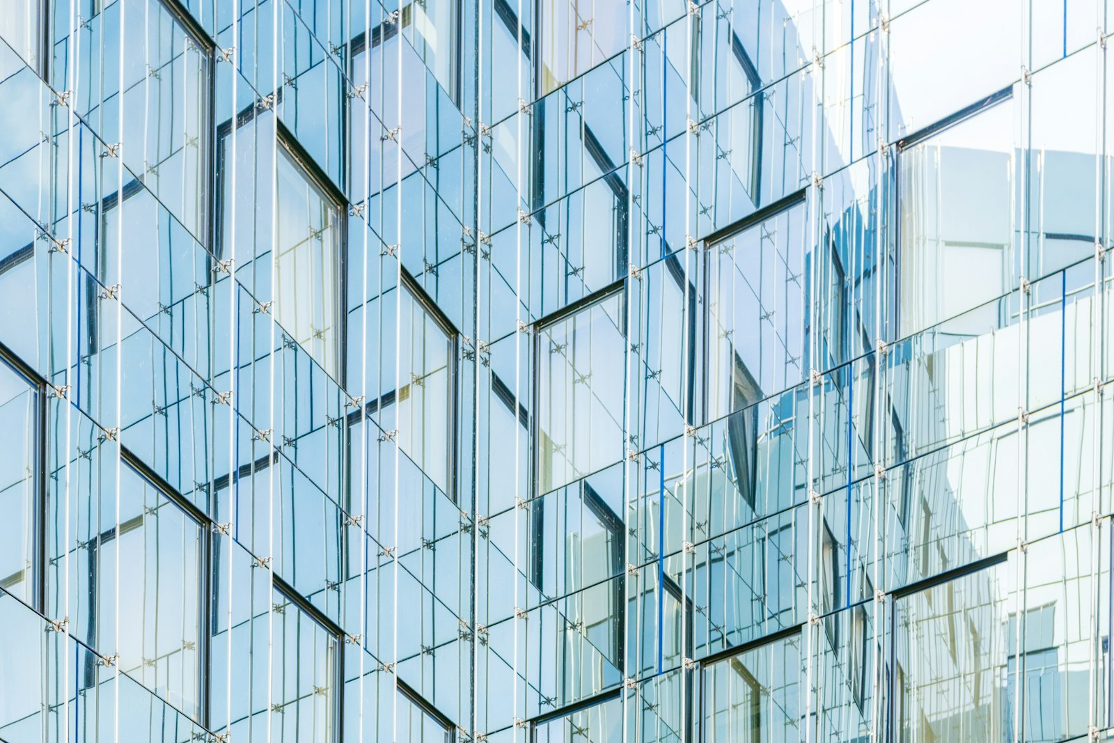 Glass facade of a private banking tower catching first light