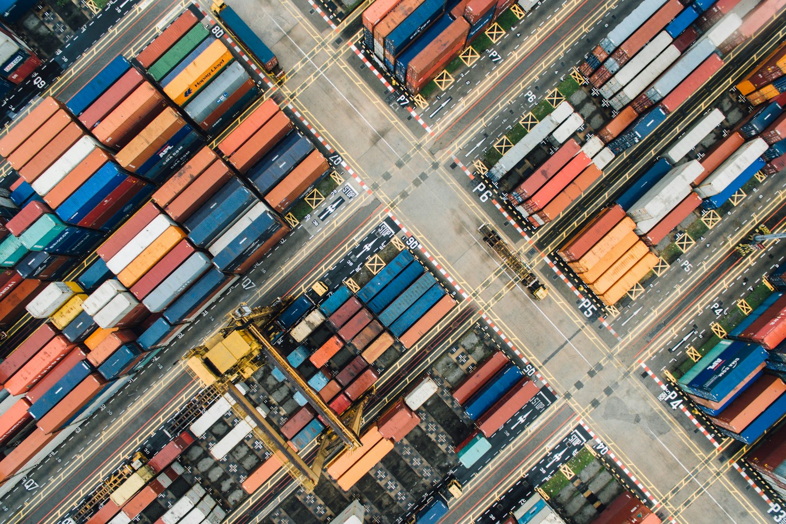 Aerial view of a container yard — the network SKYLARK replans every 90 seconds