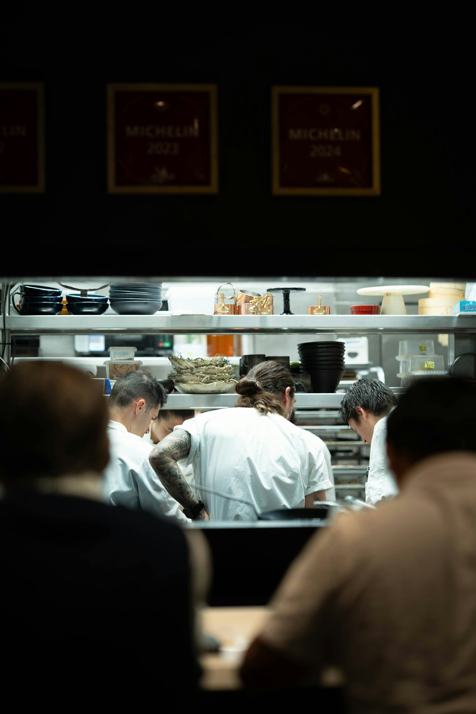 Chefs at work in a busy restaurant kitchen — the service ROOSTER F&B configures