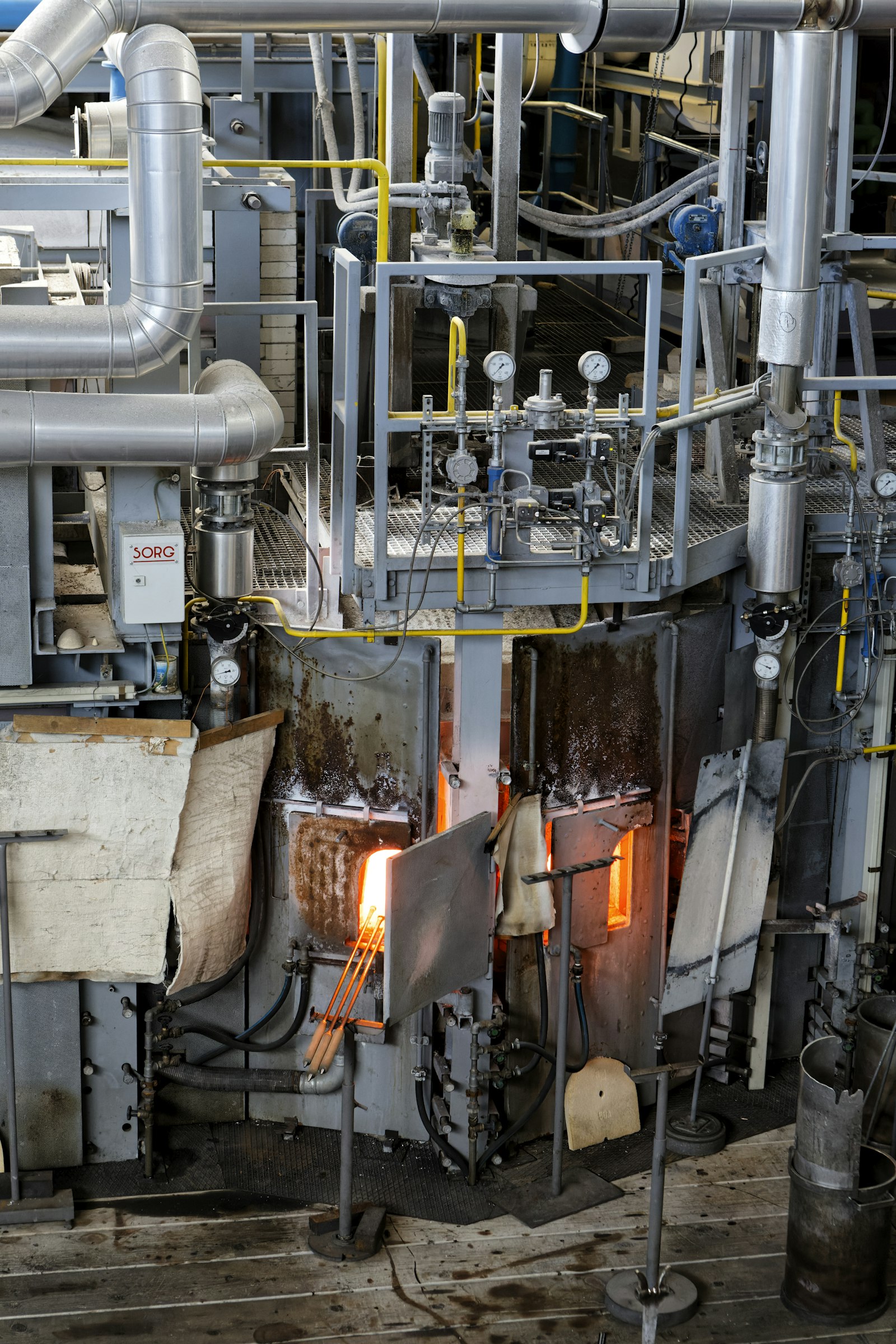 Industrial machinery on a factory floor — the equipment Fixed Assets keeps on the books